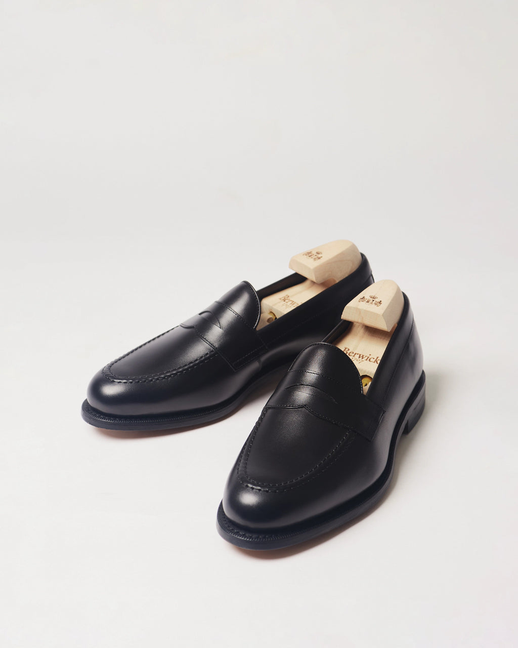 Berwick Penny Loafer 5138 Box Calf Black smooth leather shoes pair front angle view