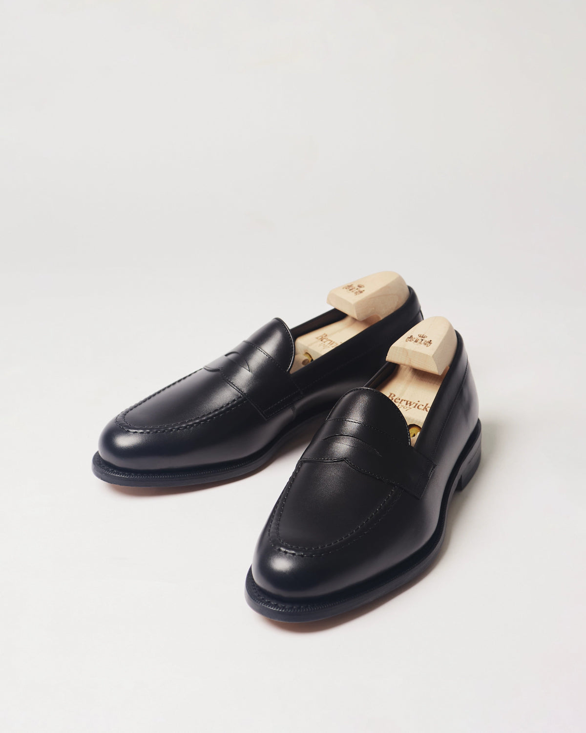 Berwick Penny Loafer 5138 Box Calf Black smooth leather shoes pair front angle view