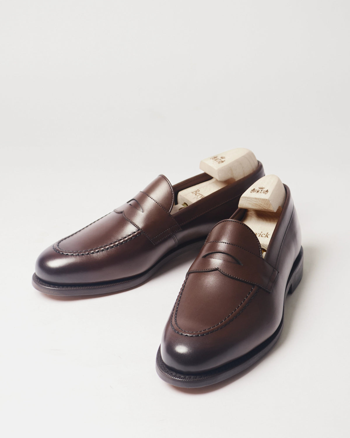 Berwick Penny Loafer 5138 Nomera Dark Brown smooth leather shoes pair front angle view