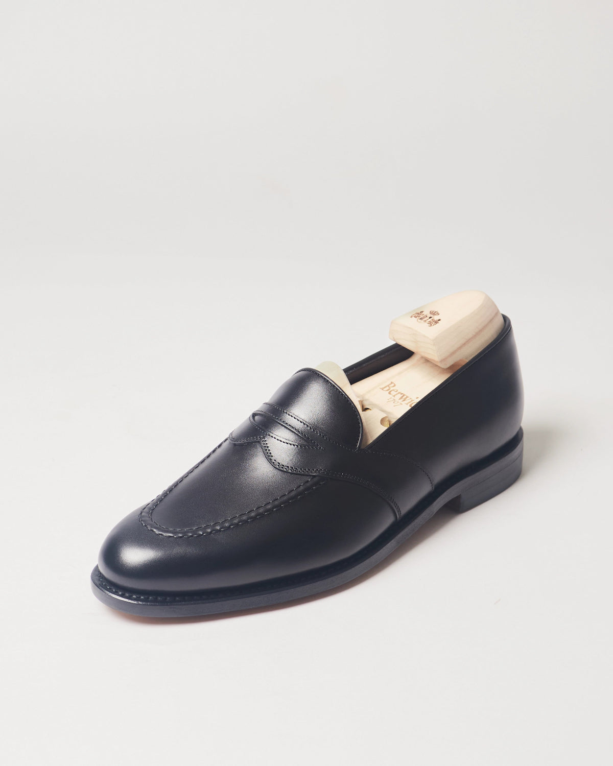 Berwick Dress Full Strap Loafer 5794 Box Calf Black smooth leather single shoe front angle view