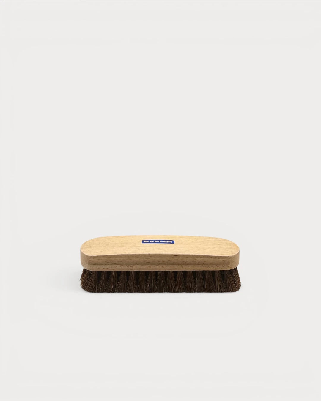Saphir BDC Horsehair Brush with brown bristles and light wooden handle side view